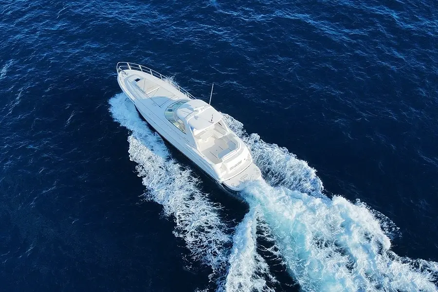 Aerial view of a private motor yacht cruising on a Punta Cana yacht rental