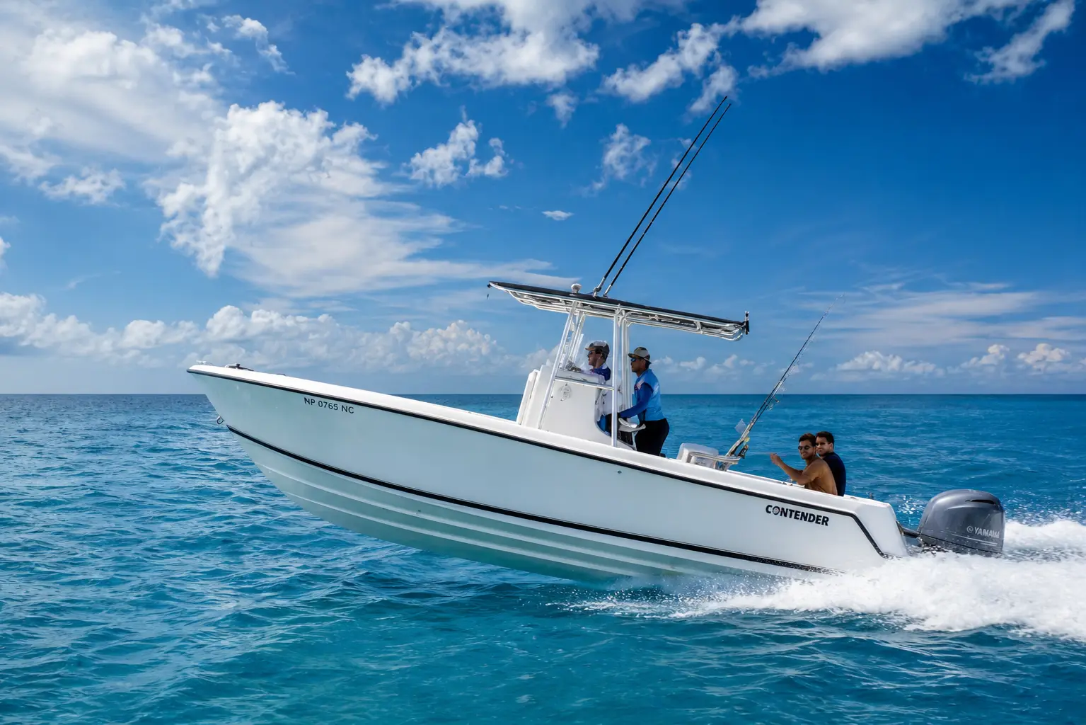 Guests ride a white T-top speedboat rigged with fishing rods as it races across open blue water