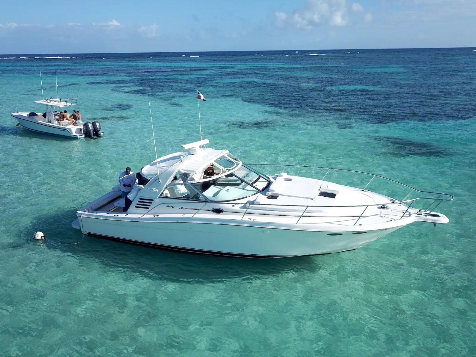 Private 40ft yacht anchored in clear turquoise water off Punta Cana