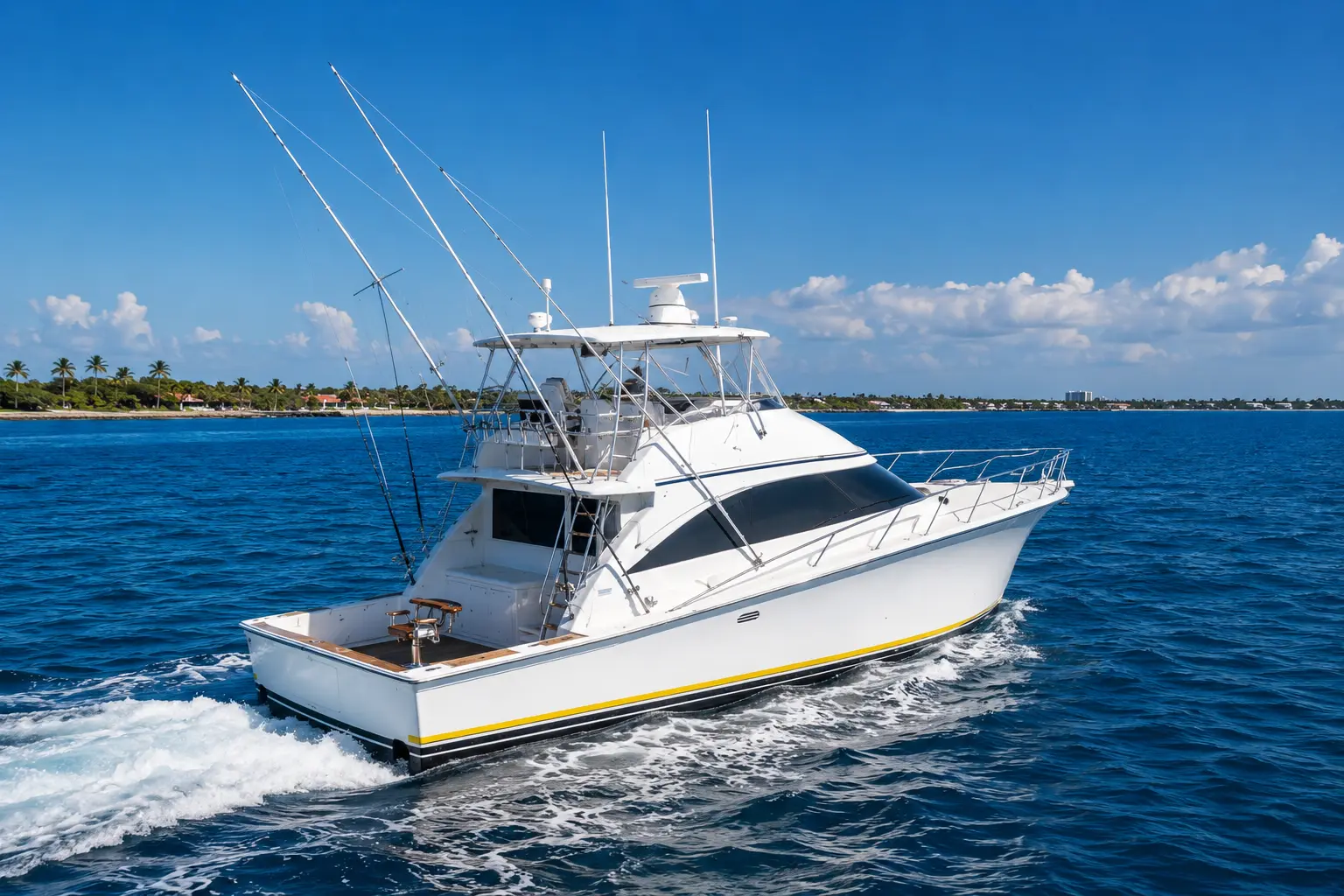 Sportfishing boat with outriggers carving a wake through deep blue water off Punta Cana