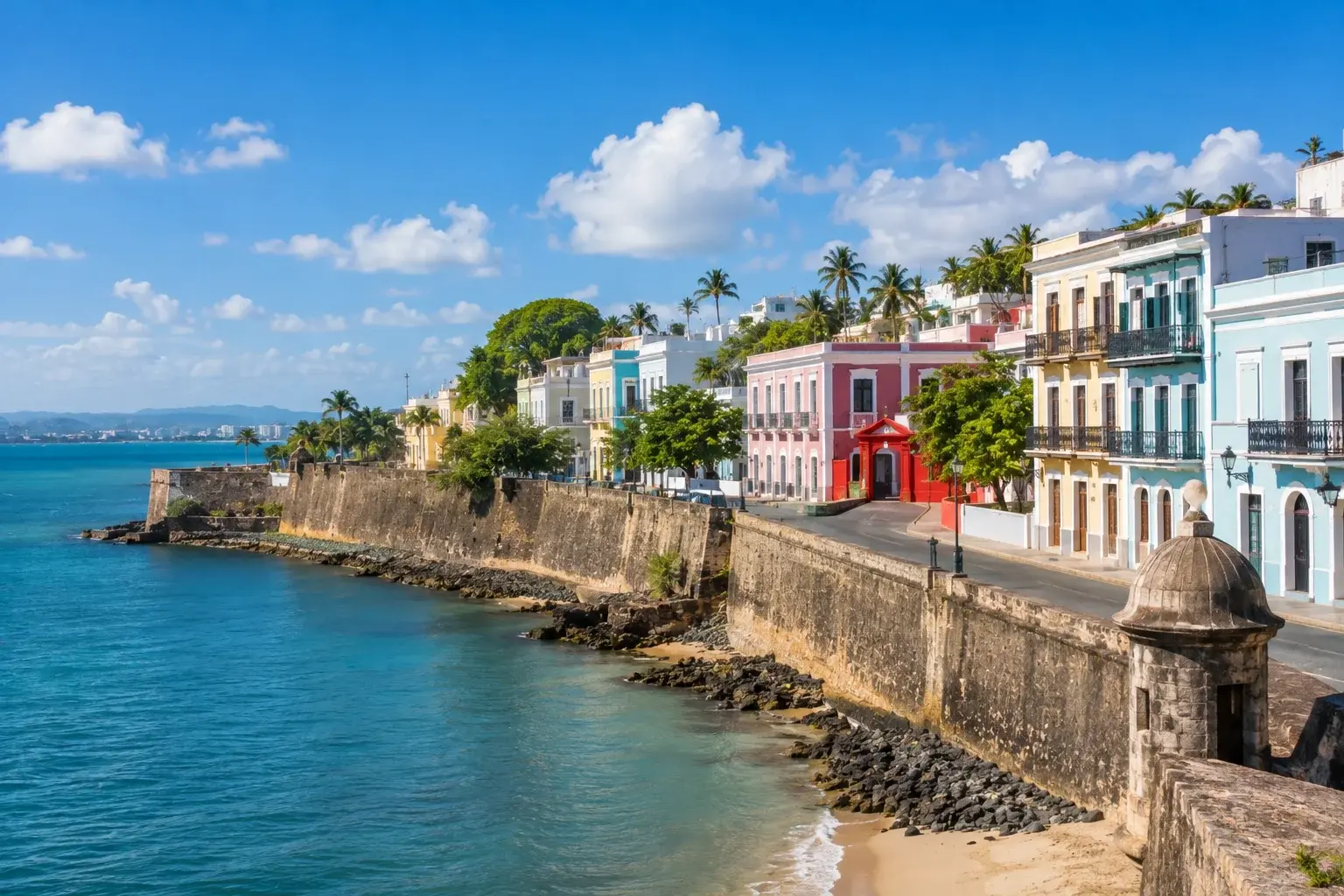 Things to Do in San Juan Puerto Rico with colorful historic buildings along the waterfront and Caribbean Sea.